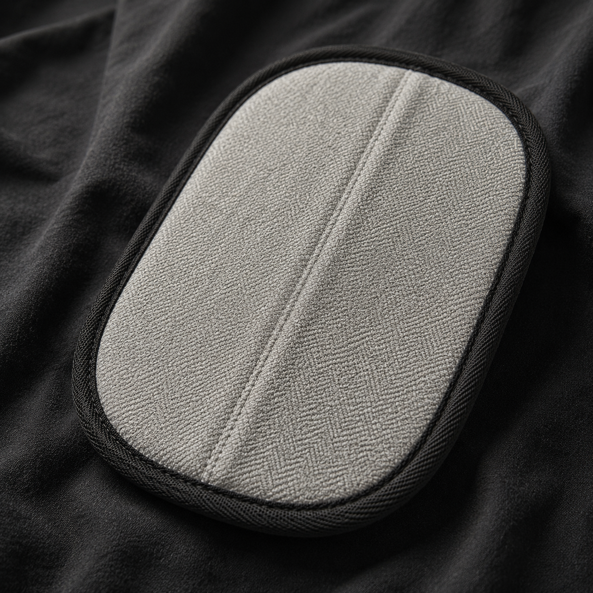 Grey woven palm side and stitched edge binding of the PeTidy mitt